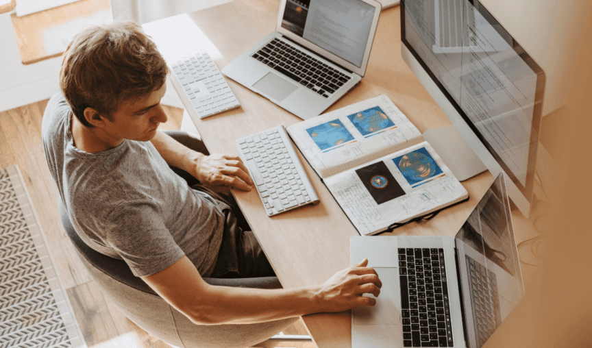 image of a man at his desk working on the july product update 2022