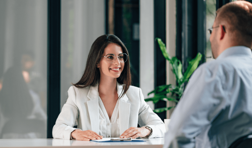 employee having a discussion in the office with her manager