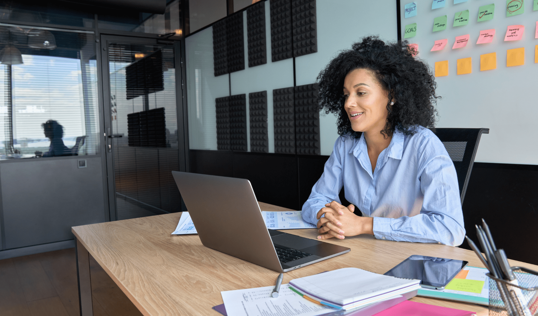 employee speaking to a coworker via video call