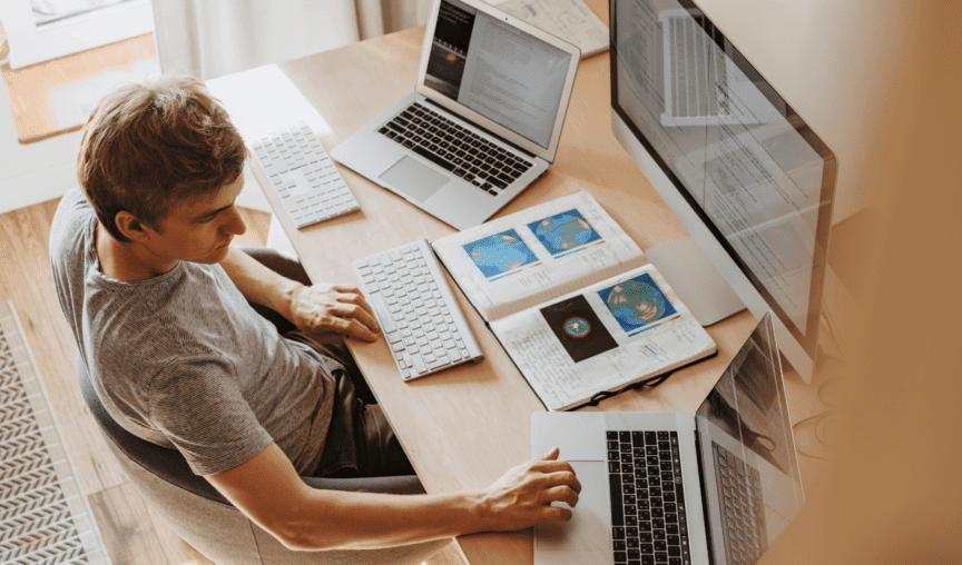 image of a man looking at his computer
