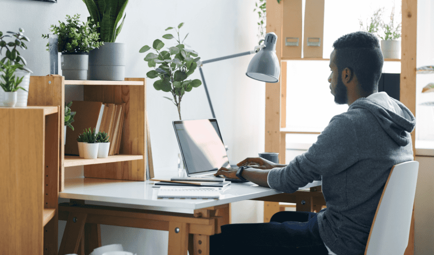 This is an image of a person sitting at a desk and working from home.