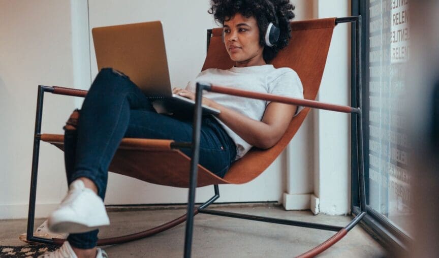 woman sitting on a chair with her laptop
