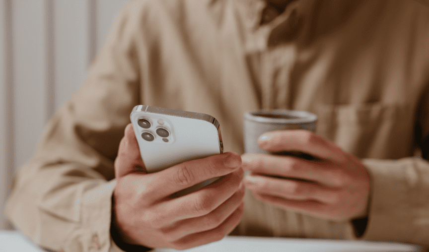 image of a person on their phone - how to increase super member loyalty