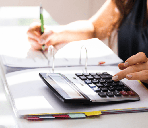 woman using the calculator at work