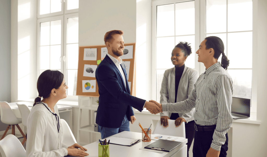 a group of colleagues shaking hands