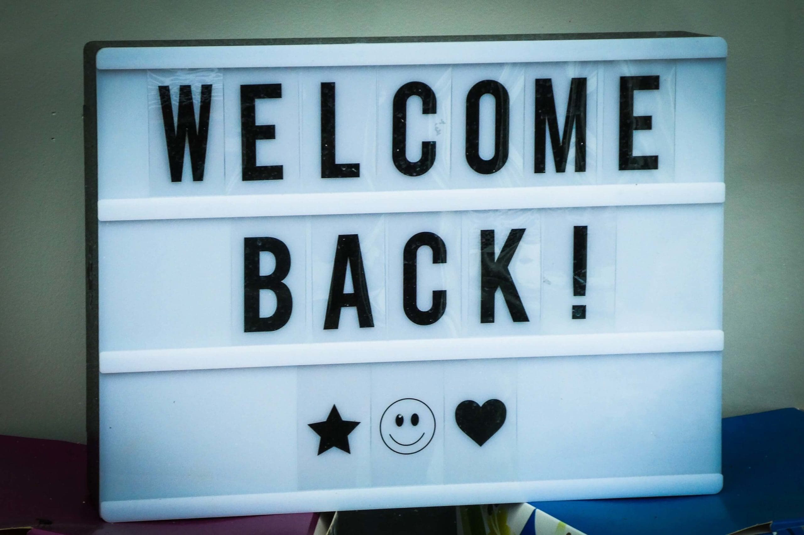 A black and white textboard reads Welcome back!